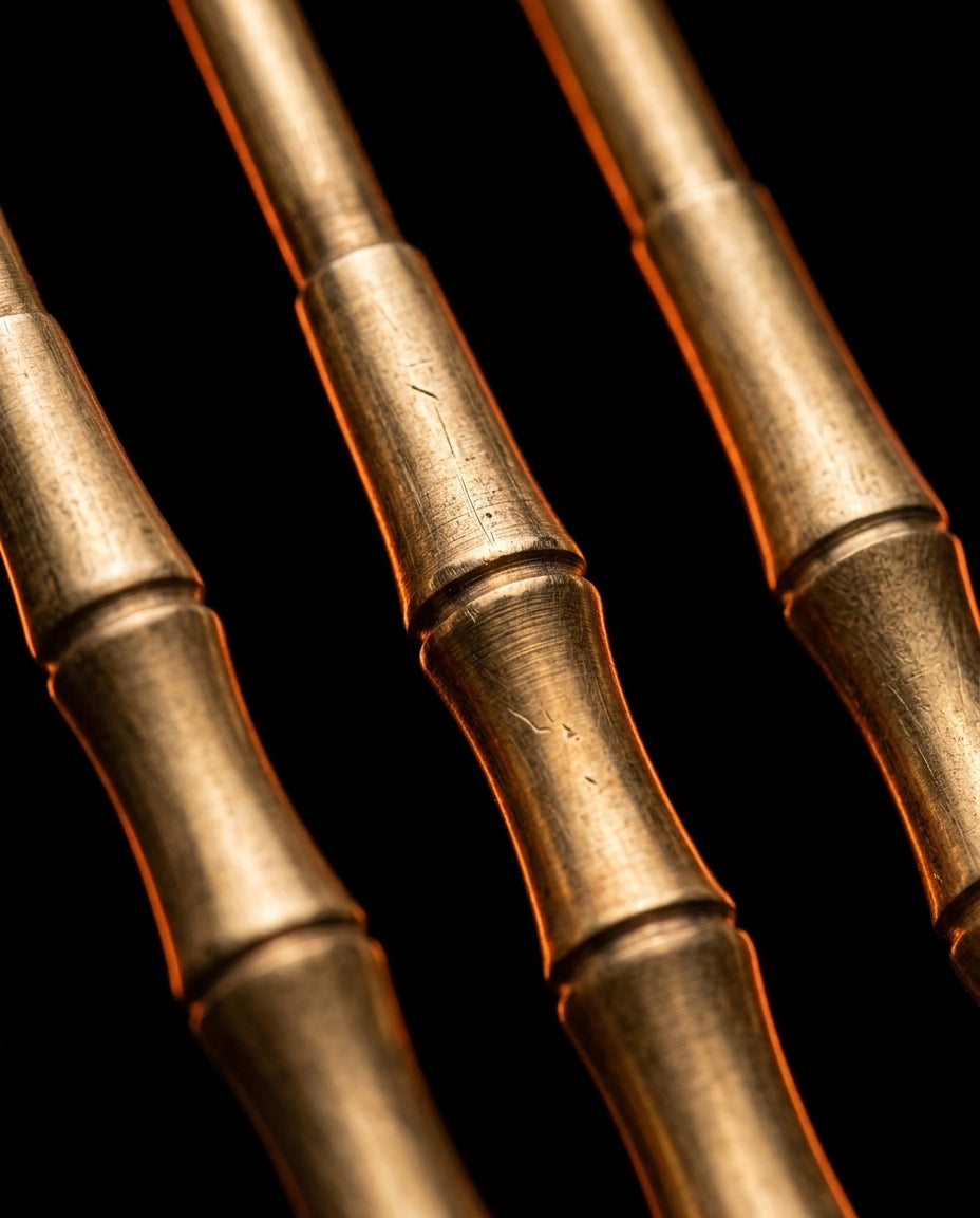 Macro of the lathe-turned bamboo-segment brass tool handles on black