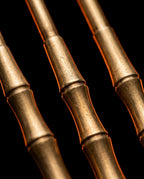 Macro of the lathe-turned bamboo-segment brass tool handles on black