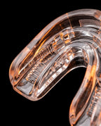 Macro of the clear bite tray and dental grooves of the mouth guard
