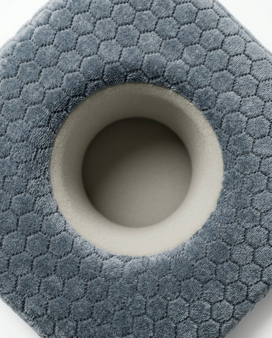 Top-down macro of the soft center ear-relief cavity on the piercing pillow