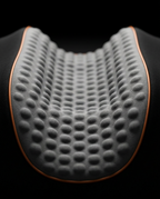Macro of the curved cervical contour and dimpled foam with orange edge piping