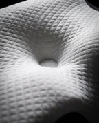 Macro of the contoured center cradle and quilted surface of the cervical pillow