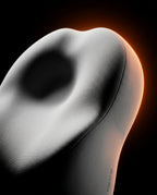 Macro of the contour pillow head cradle hollow lit by warm ember glow