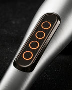 Macro of the handheld massager's control panel with glowing speed indicator lights