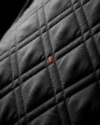 Macro of the diamond quilt stitching on the recliner cover