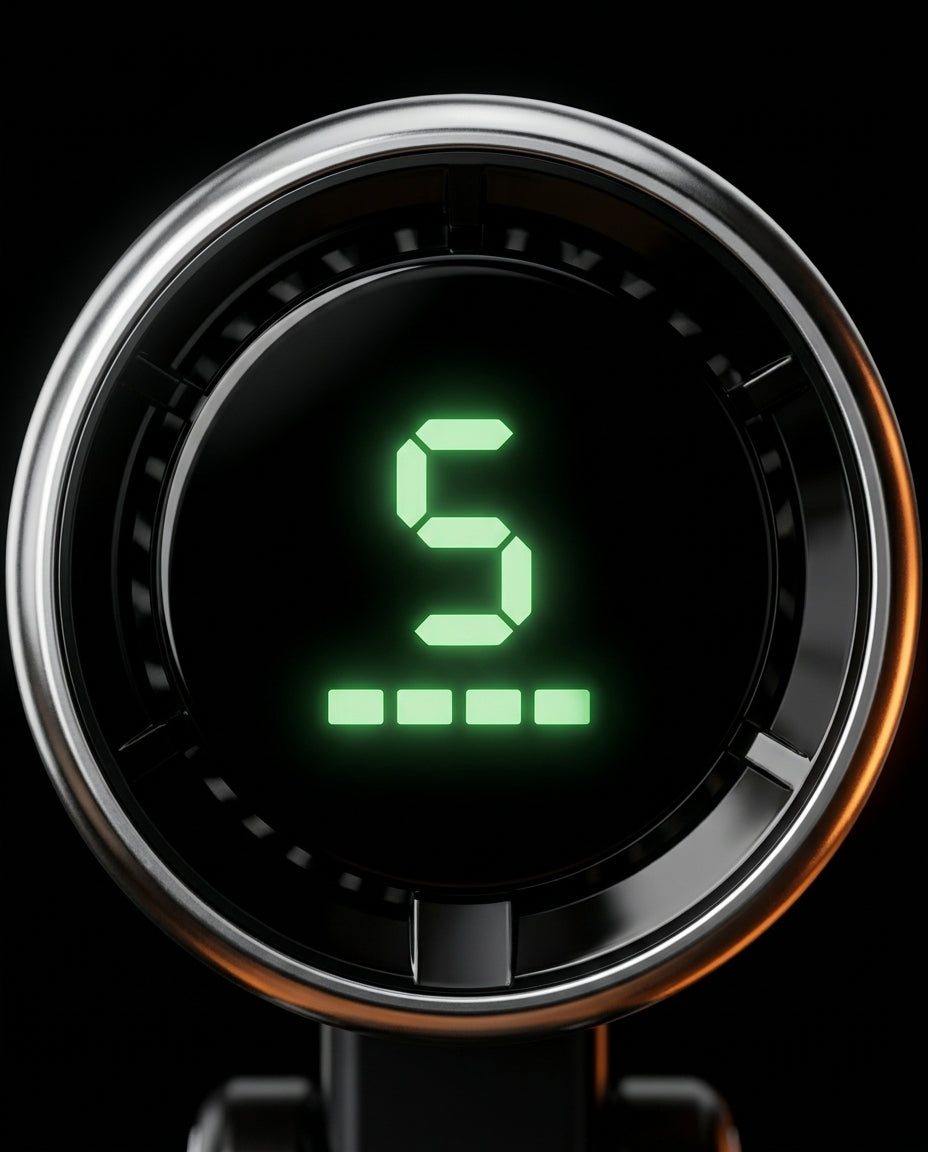 Macro of the fan's green digital display showing speed level 5 and battery bars