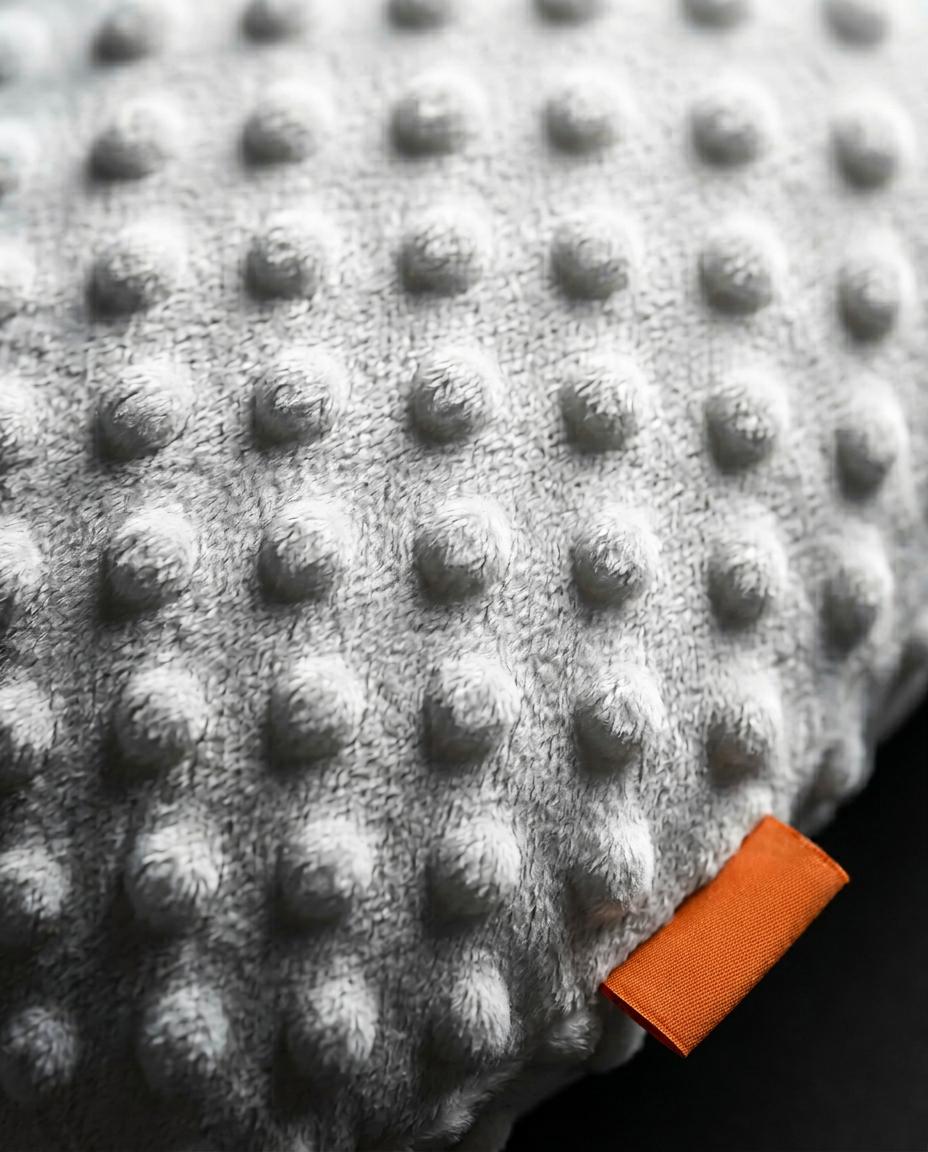 Macro of the soft dotted minky fabric of the baby comfort pillow