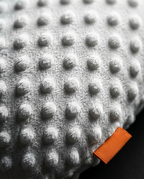 Macro of the soft dotted minky fabric of the baby comfort pillow
