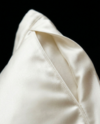 Close-up of the hidden envelope closure flap on the silk pillowcase