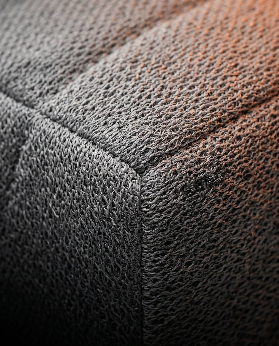 Macro of breathable woven knit cover and seam on the support cushion