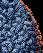 Extreme macro of the cooling blanket's woven blue fiber threads
