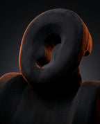 Macro of the breathing-hole face cradle on the black face-down comfort pillow