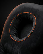 Macro of the breathable face cradle opening with orange piping and mesh base