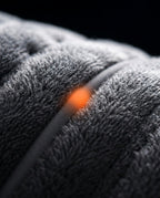Macro of the plush grey fleece surface of the electric heating pad