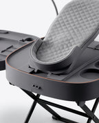 Close-up of the cushioned grey foot cradle pad on the foot care station