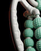 Close-up of the white ergonomic grip frame and green roller balls