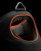 Macro of the padded black halter with orange-trimmed chin and neck support