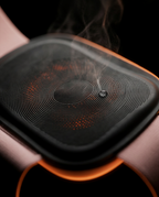 Macro of the belt's heat pad glowing warm with rising vapor
