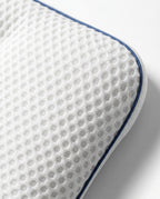 Macro close-up of the breathable honeycomb knit cover of the baby pillow