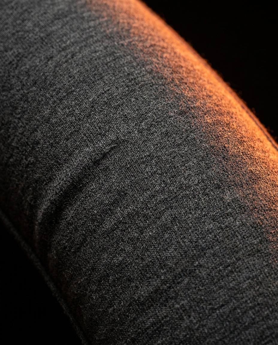 Macro of the soft grey jersey fabric covering the travel neck pillow
