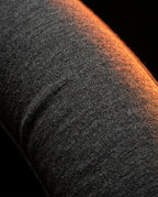 Macro of the soft grey jersey fabric covering the travel neck pillow