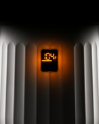 Macro of the towel warmer's glowing LED display reading 104 degrees