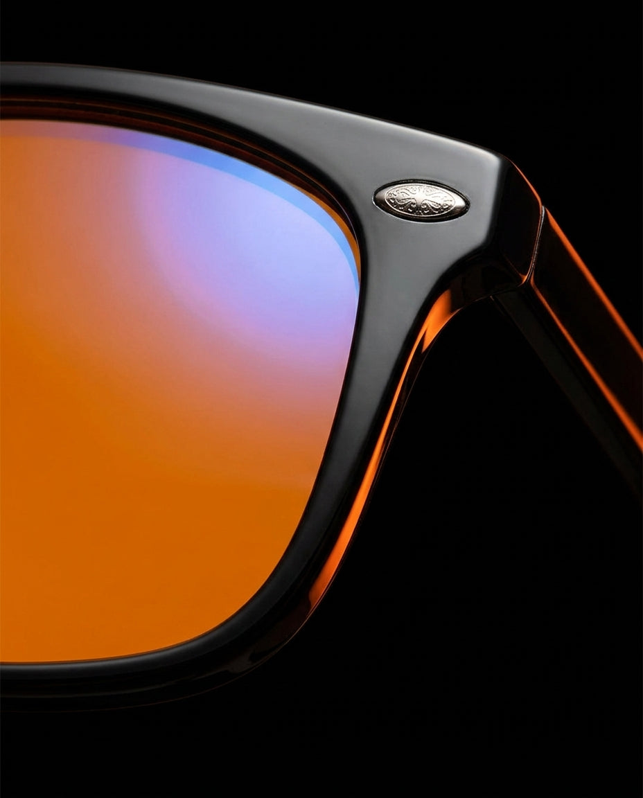 Macro close-up of the orange blue light blocking lens and silver frame rivet