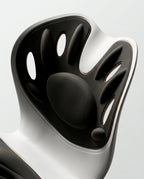Macro of the sculpted lumbar cradle backrest of the posture support seat
