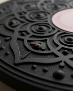 Macro of the raised mandala grip relief on the black balance board