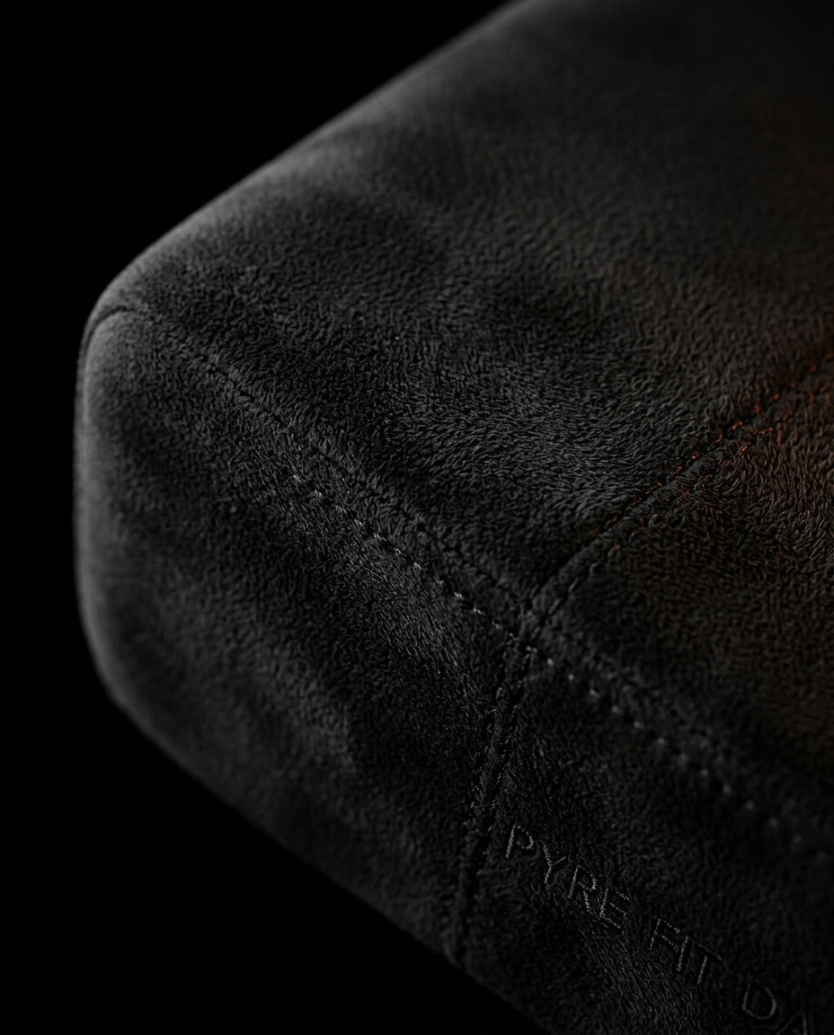 Macro of the soft black microfiber cover and stitched seam of the foot rest