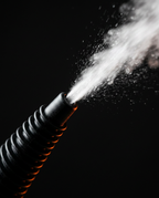 Macro of the steam cleaner's nozzle releasing a jet of hot vapor