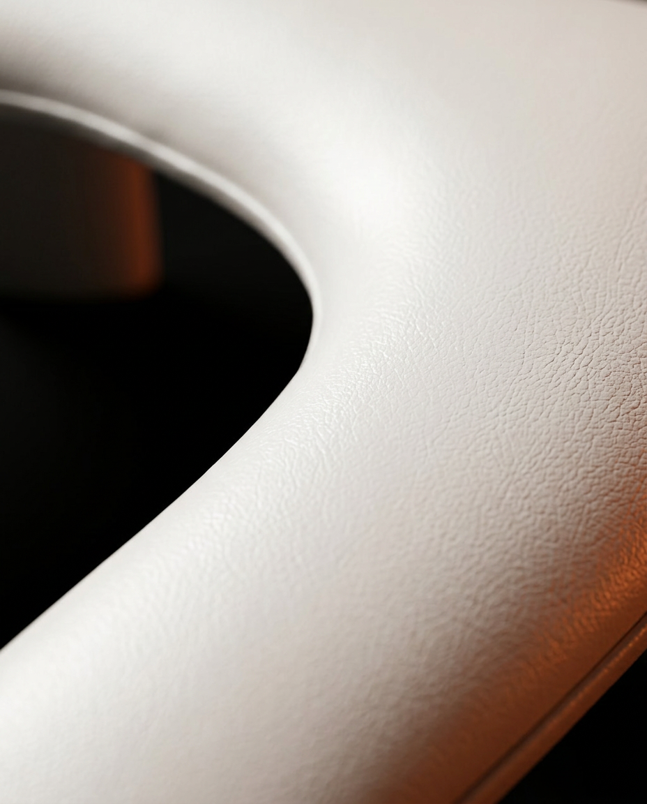Macro of the soft padded surface and curved opening of the nail rest
