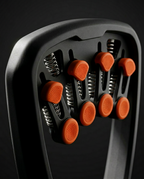 Macro of the orange spring-loaded finger pistons and steel coils