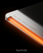 Macro of the aluminum monitor stand edge with glowing orange RGB light bar