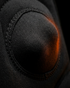 Macro of a massage node on the cushion glowing with orange heat