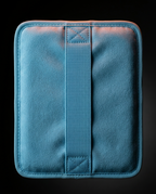Close-up of the blue fabric sleeve and elastic securing strap