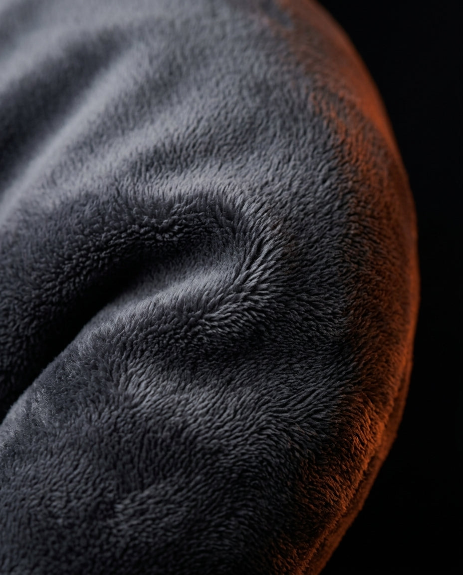 Macro close-up of the soft grey velvet cover of the body pillow
