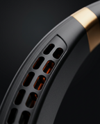 Macro of the air vent slots along the inner edge of the black neck fan