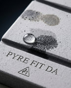 Macro of a water droplet absorbing into the porous diatomite bath mat