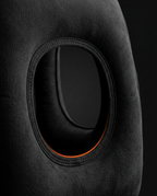 Close-up of the oval arm cutout on the black inflatable travel pillow