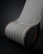 Close-up of the channeled headrest bolster and seat with bright orange edge piping