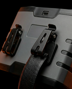 Close-up of the back belt clips securing the cooling unit to a waistband