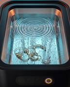 Close-up of cavitation bubbles cleaning jewelry in the lit tank