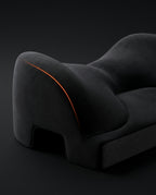 Studio macro of the sculpted black chest bolsters with orange accent line