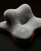 Angled view of the grey contoured pillow showing its sculpted central cradle and lobed shape