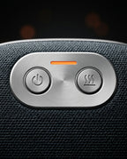 Macro of the brushed-metal control deck with power and heat buttons