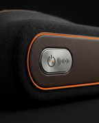 Close-up of side control panel with power, heat and massage buttons