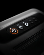 Close-up of the ice maker control panel with glowing orange power button