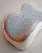 Close-up of the contoured leg cradle channels on the grey knee pillow