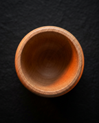 Top-down view into the hollow wooden massage cup interior